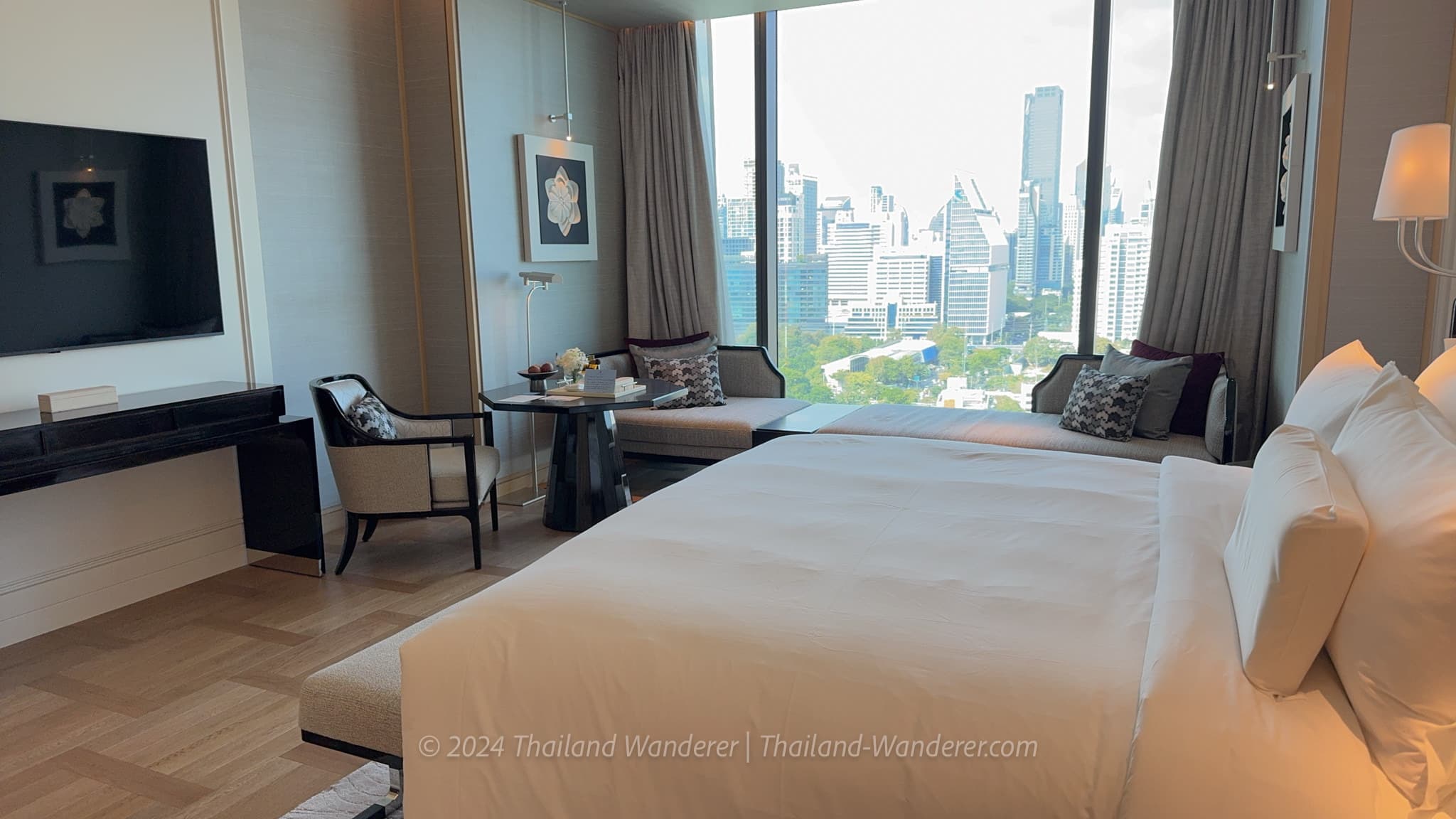 Modern luxury bedroom with large windows at The Ritz-Carlton Bangkok