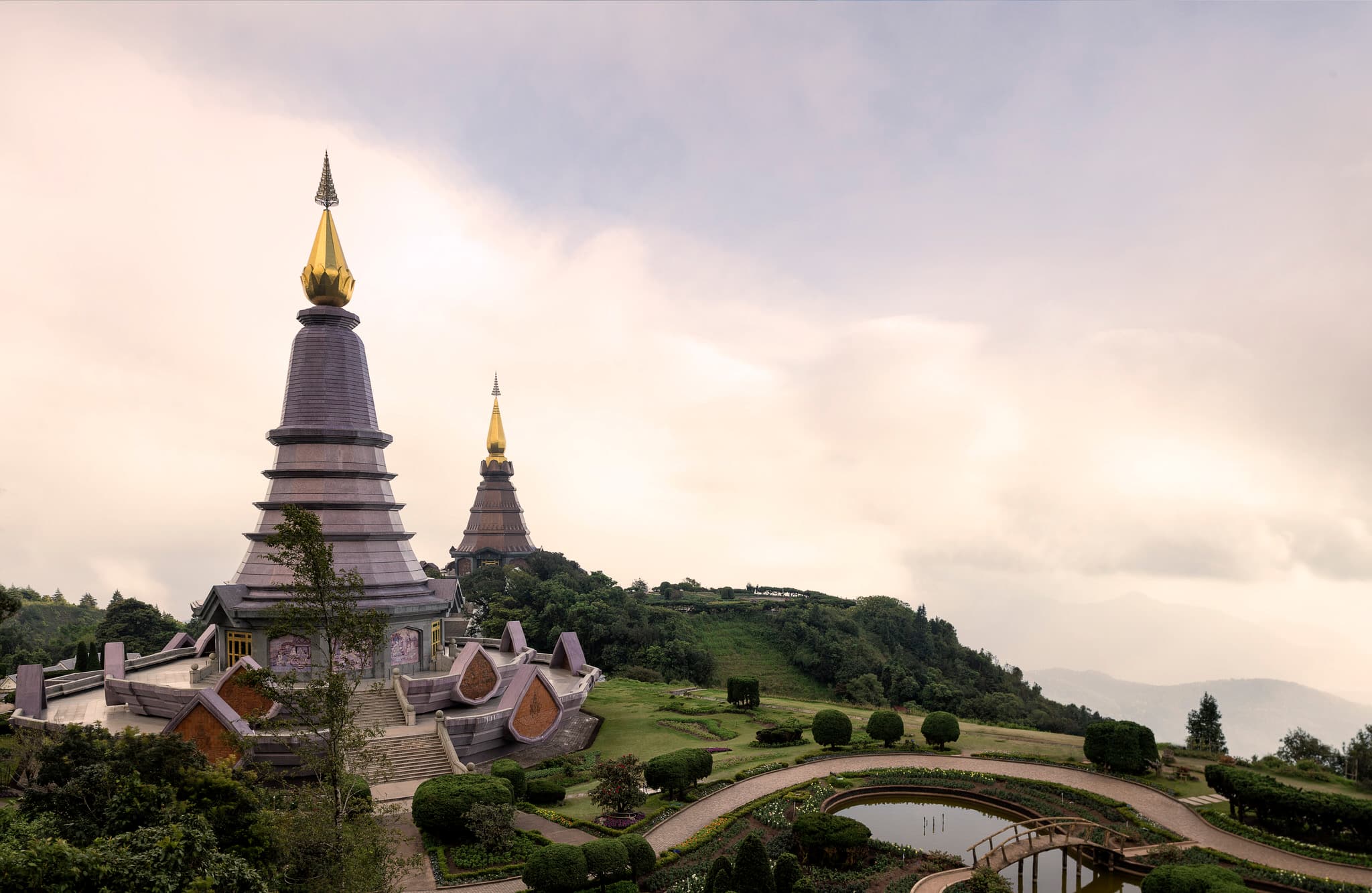 Scenic view of the twin stupas on Doi Inthanon with misty mountains in the background