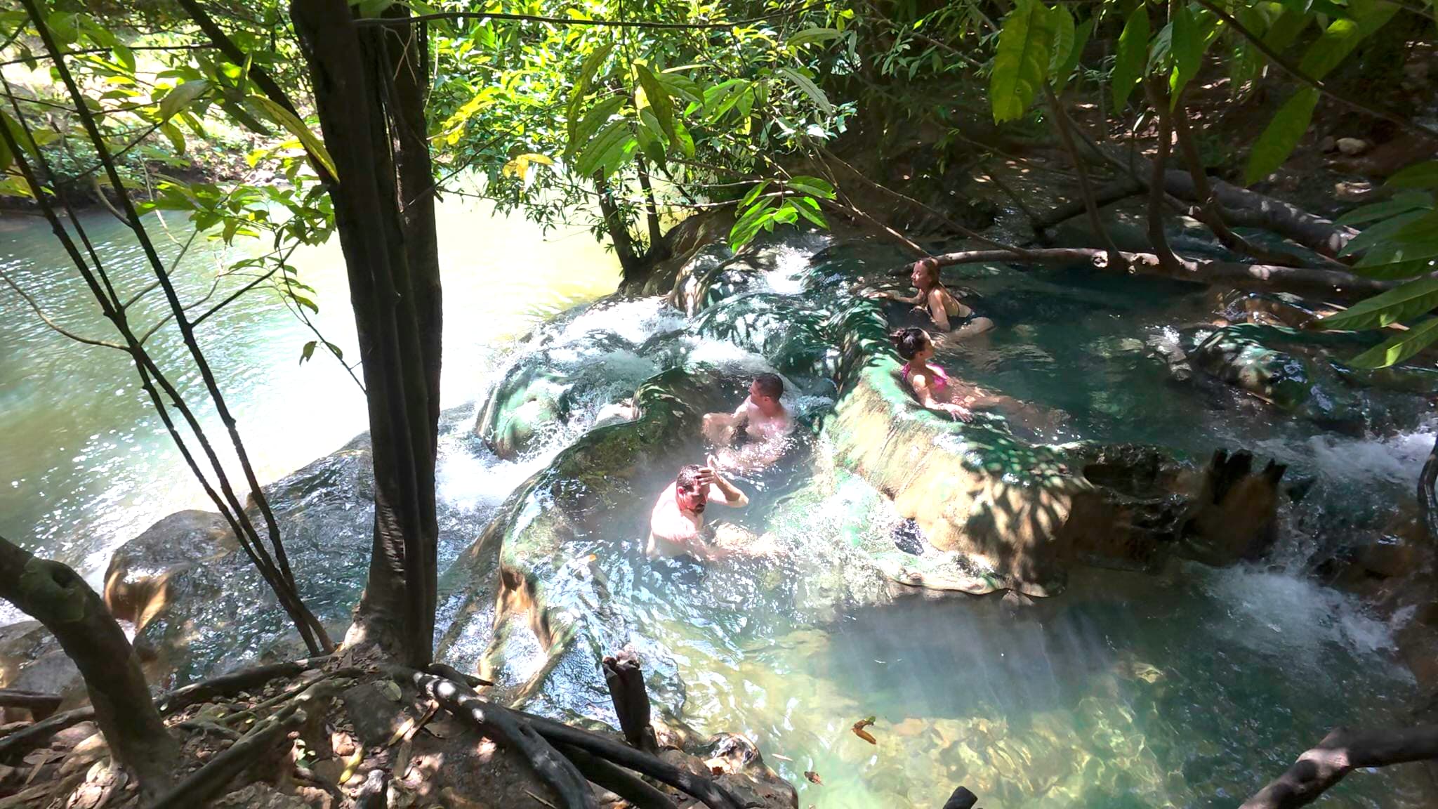 Klong Thom Hot Springs with steaming water flowing through rocky pools