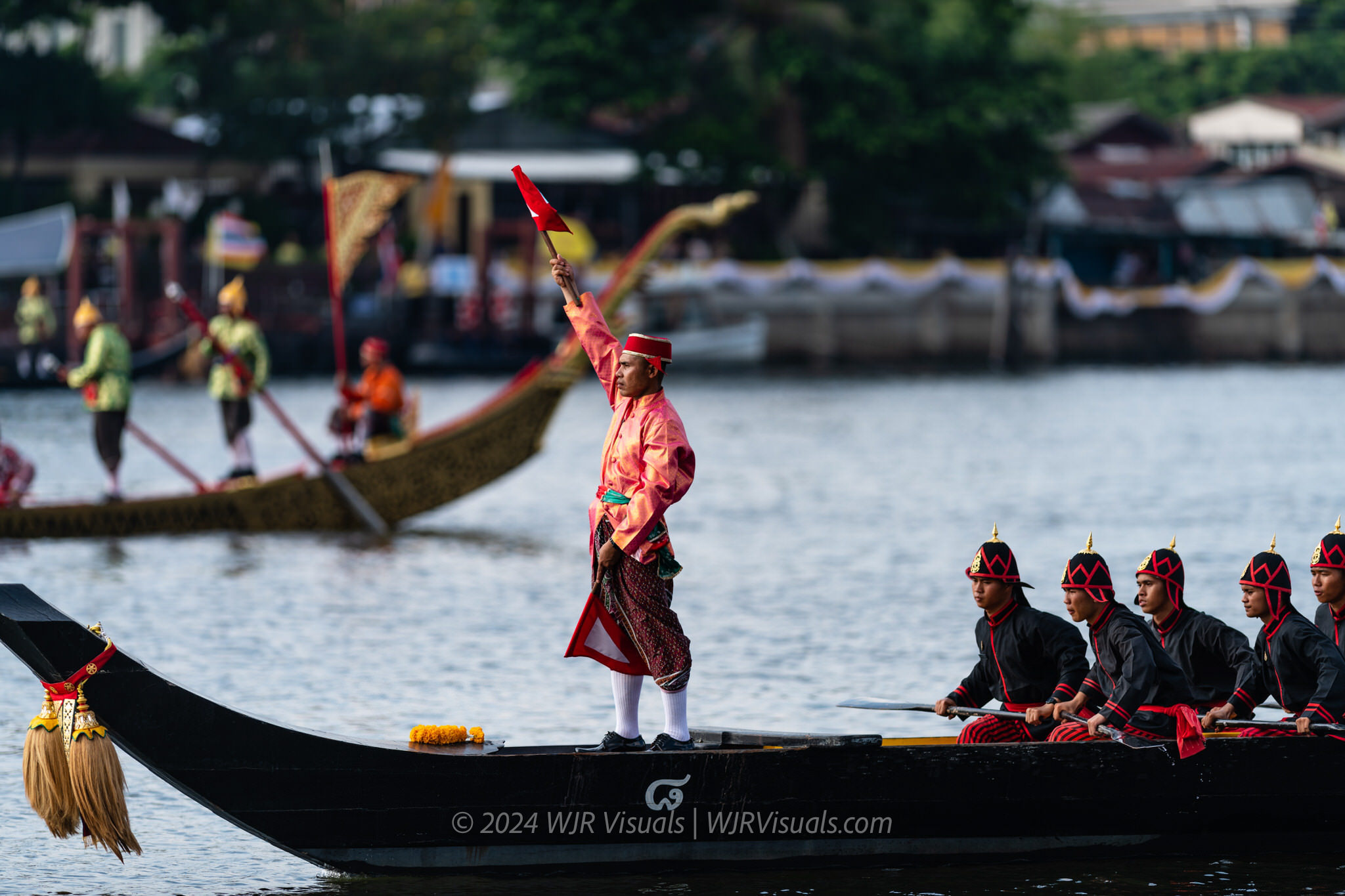 Royal barge crew member signaling during Chao Phraya River procession