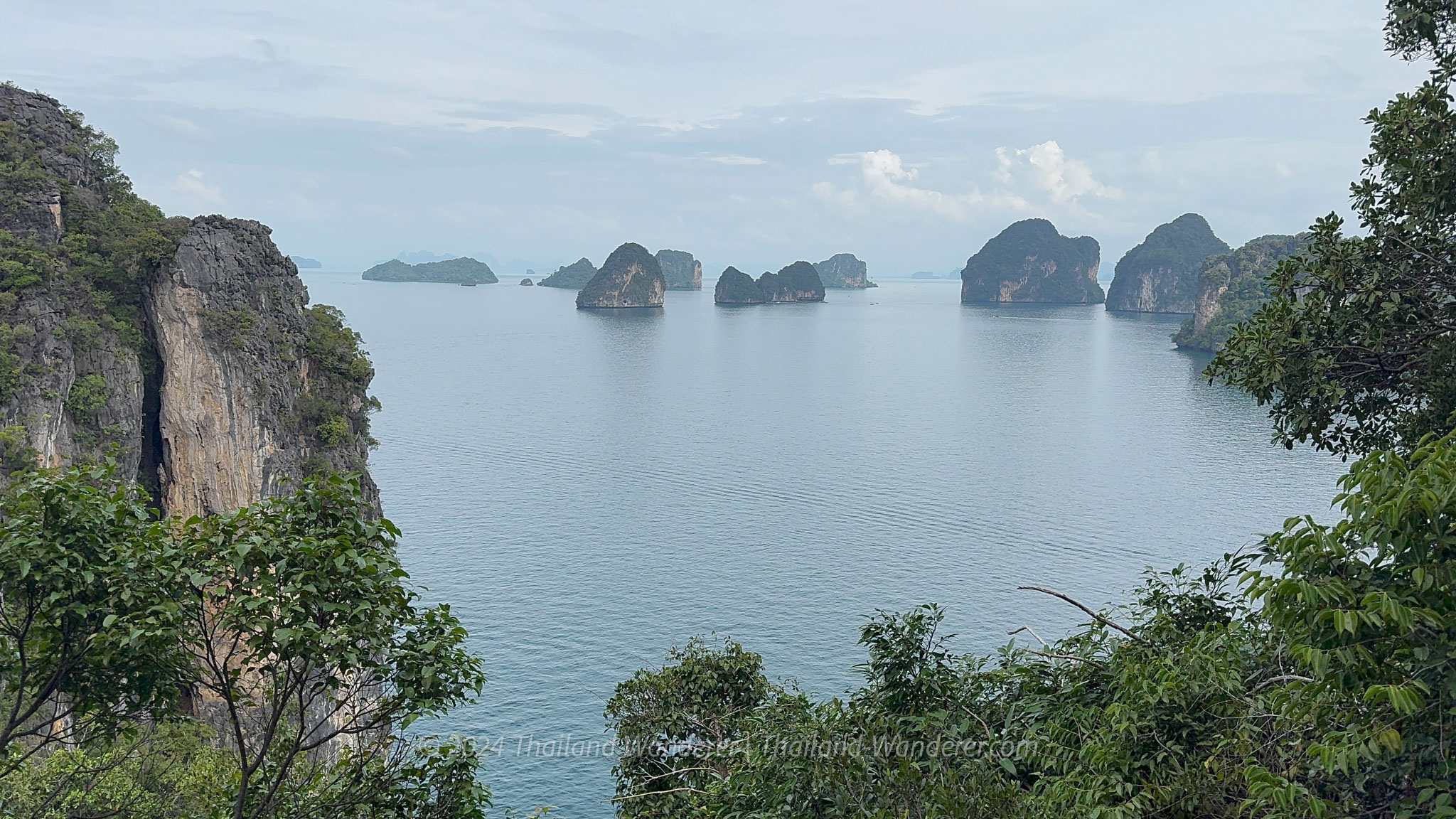 A panoramic view from the Hong Island 360 viewpoint, overlooking scattered limestone islands in the turquoise sea